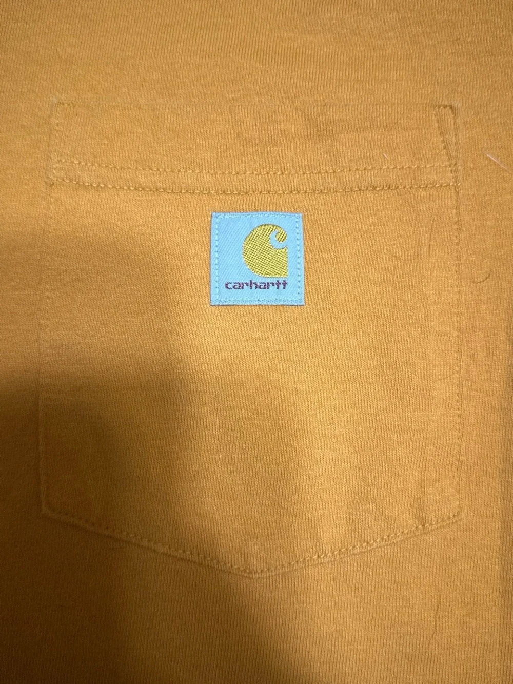 Orange Carhartt pocket tee